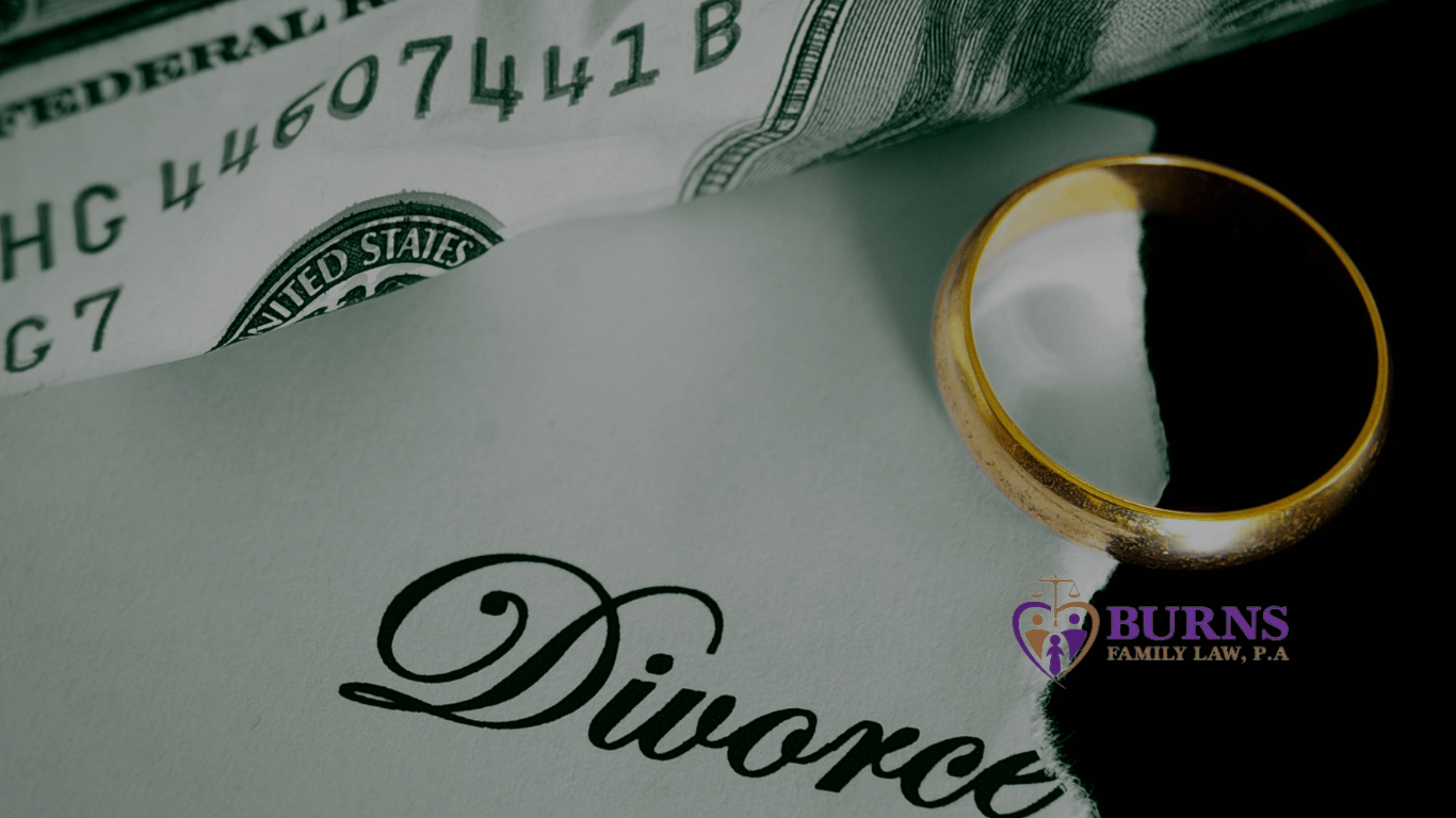 A wedding ring over divorce paperwork. Kissimmee Divorce Attorney.